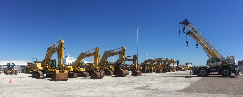 Heavy construction equipment staged at Port Tampa Bay Foreign-Trade Zone, supporting cargo handling, logistics and industrial operations.
