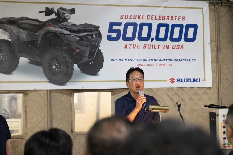Aerial view of Barron Stadium and the surrounding River District in Rome, Georgia, at sunrise, showcasing the athletic field, downtown area, and scenic hills.