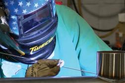 Welder in manufacturing plant