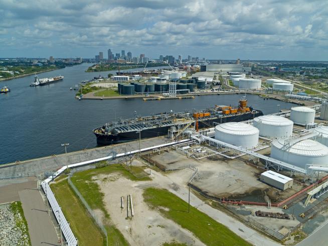 Aerial view of Port Tampa Bay showing cargo terminals, fuel storage tanks, liquid bulk facilities, and ships supporting global trade and logistics. Aerial view of Port Tampa Bay showing cargo terminals, fuel storage tanks, liquid bulk facilities, and ships supporting global trade and logistics.