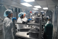 Working in the clean room at Amethyst Research, Inc., in Ardmore, Oklahoma