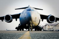 Roaring to life: Tech. Sgt. Mark Shertzer watches as the engines of a C-17 Globemaster III are started March 20, 2011 at Yokota Air Base, Japan (U.S. Air Force Photo/Staff Sgt. Jonathan Steffen)