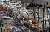 Workers install doors on Chevrolet Malibu and Buick LaCrosse vehicles at the General Motors Fairfax Kansas Plant Tuesday, April 20, 2010 in Fairfax, Kansas. GM announced Wednesday, April 21, 2010, a $257 million investment to produce the next generation Chevrolet Malibu at Fairfax and the Detroit Hamtramck Plant. (Photo by Steve Fecht for General Motors)