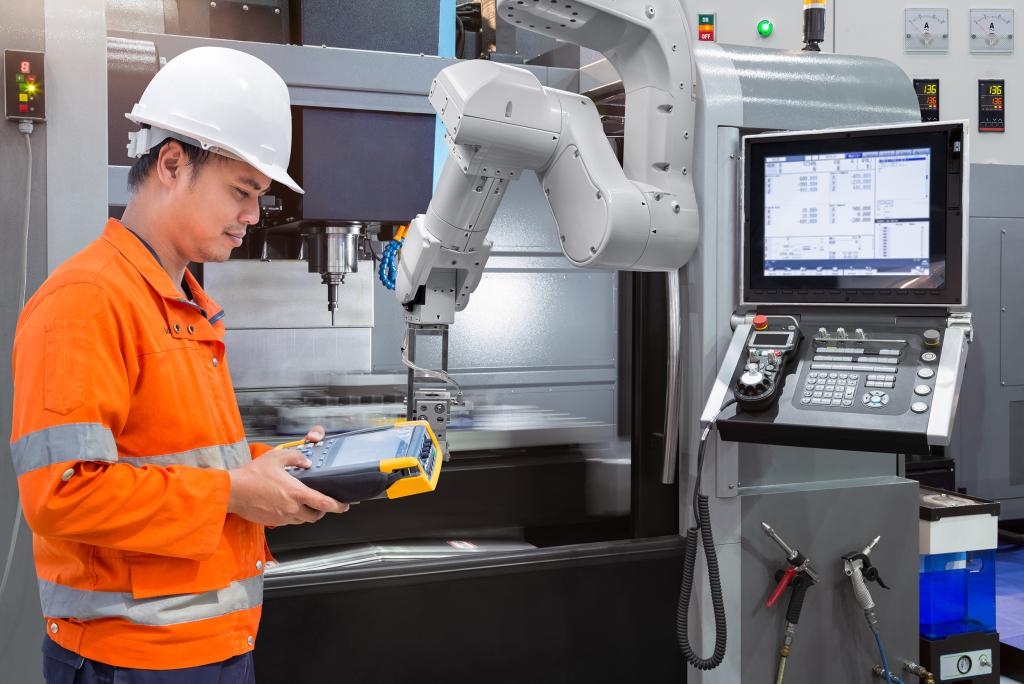 manufacturing worker uses technology